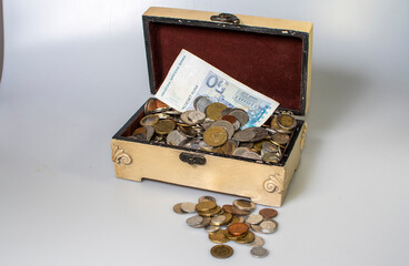 small carved box with old coins