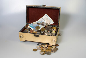 small carved box with old coins