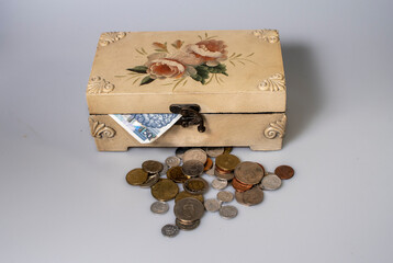 small carved box with old coins