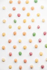 Close up of colorful fruit caramel, hard sugar candies or boiled sweets isolated on white background. 