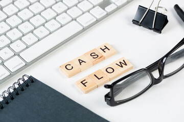 Cash flow statement concept with letters on cubes