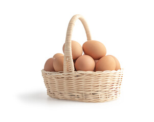 Eggs in the wooden basket on the white background