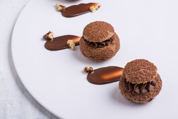 chocolate cupcake on white plate, close-up