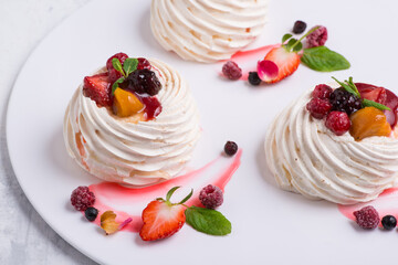 delicious cake with berries on a white plate