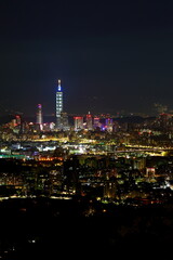 Fototapeta na wymiar The modern city of Taipei, buildings cityscape at night view the capital of Taiwan.