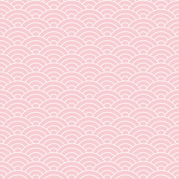Japanese wave pattern. Seigaiha in pink and white. Seamless pastel ocean waves circles line background for wallpaper, textile, or other traditional decorative print. Symbol of tranquility.