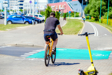 Cyclist ride on the bike path in the city street