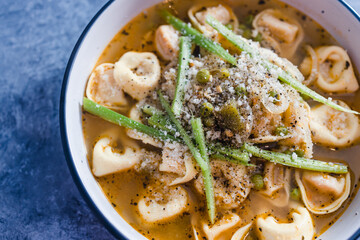 plant-based food,  vegan ravioli pasta with vegetable broth and celeri topping