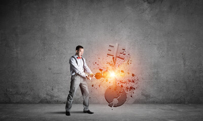 Breaking through access concept with man in room crashing concrete key