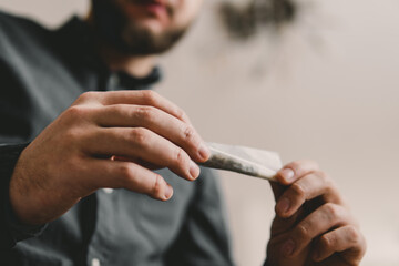 marijuana cannabis joint. Rolling a marijuana joint. Cannabis use concept. Preparing and rolling...