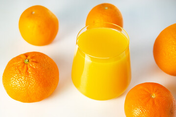 A glass of fresh orange juice from the top view. on white background