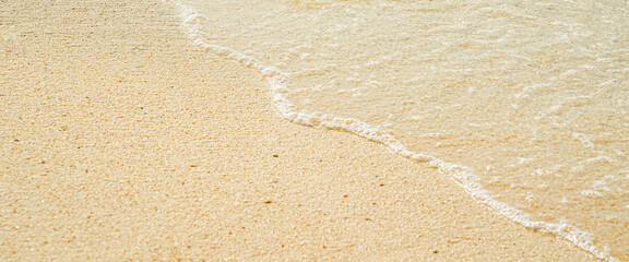 wave on sand with Beach sand background. Water bight background