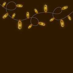 Christmas garland on a brown background with a place for your design. Garland of yellow bulbs. Background with garland