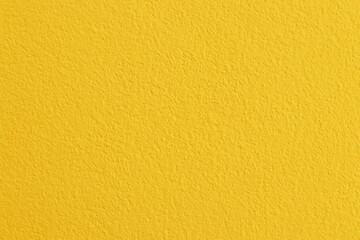 Yellow concrete cement wall texture for background and design art work.