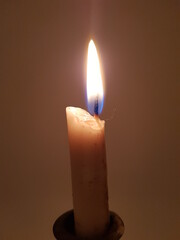 Candle in a candlestick, vintage candle holder on a white background