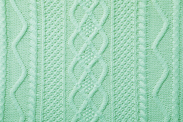 Surface of winter clothing as background. Image toned in mint color
