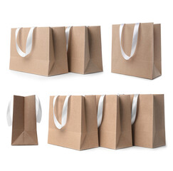 Set with kraft paper shopping bags on white background