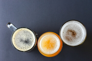 Assortment of beer glasses isolated on black background. Top view. Different kinds of beer