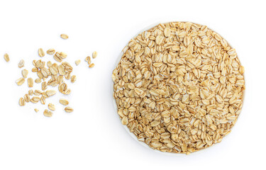 Oat flakes in a bowl isolated on white background. Pile of oatmeal top view. Healthy breakfast concept.