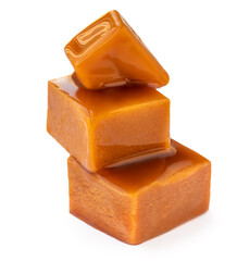 Caramelized Caramel toffee candy isolated on white background. Homemade caramel pieces with sauce