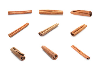 Set with aromatic cinnamon sticks on white background