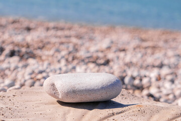 Pebbles on the beach. Stone on the shore. Copy space banner. Travelling, travel concept. Empty summer beach, tourism.