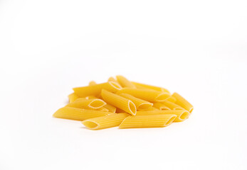 yellow pasta on white plate close up