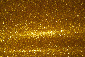 gold Sparkling Lights Festive background with texture. Abstract Christmas twinkled bright bokeh defocused and Falling stars. Winter Card or invitation	