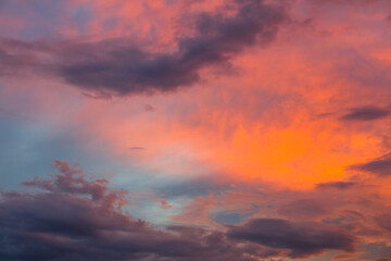 Naklejka na ściany i meble Evening dramatic sky with red clouds