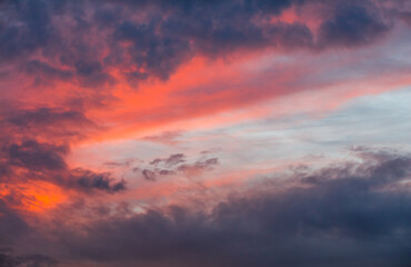 Fototapeta na wymiar Evening dramatic sky with red clouds
