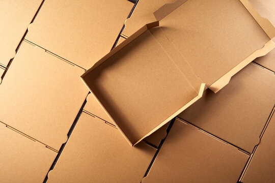Unused open empty brown cardboard pizza box