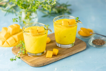 Yellow Indian mango yogurt drink Mango Lassi or smoothie with turmeric and saffron. Healthy...