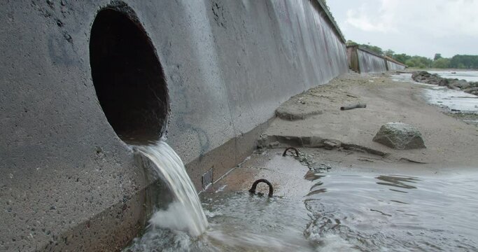 Environment pollution from sewer pipe wastewater flowing into sea water