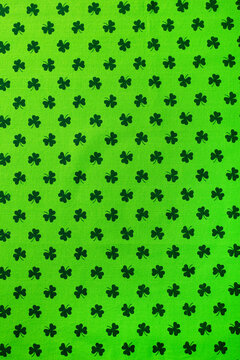 Shamrock pattern green textile. St. Patrick's Day background. Copy space. Top view. © annapustynnikova