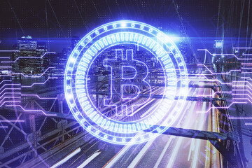 Multi exposure of cryptocurrency theme hologram drawing and city veiw background. Concept of blockchain and bitcoin.