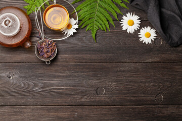 Obraz na płótnie Canvas Herbal tea in teapot and cup
