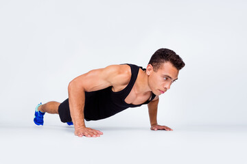 Portrait of his he nice attractive content sportive strong macho dedicated guy doing exercise...