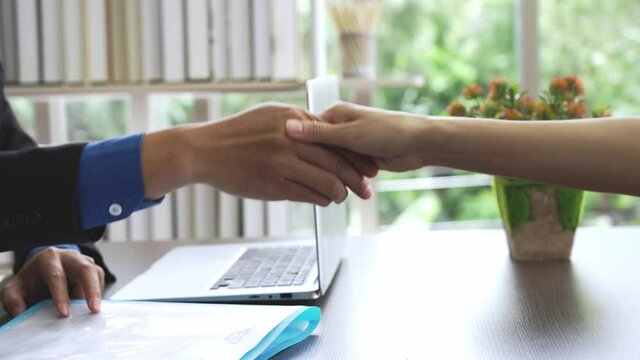 Closeup business hand shake, Success interview and employment or agreement concept, Zoom out shot 4K