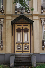 Old wooden house with carved windows, frames and door on Pushkin Street, 11, Yaroslavl city,...