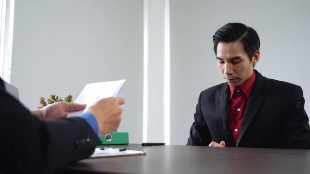 Manager or business owner give terminate letter to employee to layoff, Business down sizing concept