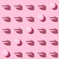 Seamless regular creative pattern of colorful french cookies macarons. Monochrome image.