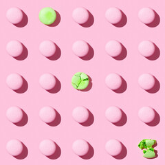 Seamless regular creative pattern of colorful french cookies macarons.