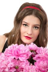 Portrait of a beautiful girl with pink flowers. Woman portrait in the style of the seventies.