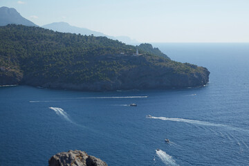 From La Torre Picada, we can see the Cabo Gros Lighthouse located on a promontory at the west entrance to the port of Sóller, on the island of Mallorca, Spain.