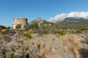 Fototapeta na wymiar The Torre Picada, an old watchtower located on the Costa de la Atalaya, from here you can see the Port of Sóller, the sea and the Island of S'Illeta.