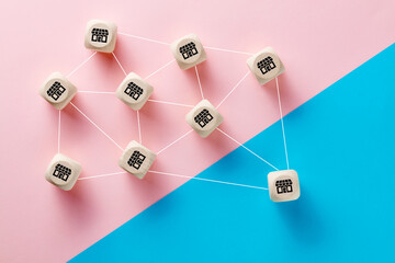 Franchise, business growth and logistics concept. Wooden cubes with store icons linked to each...