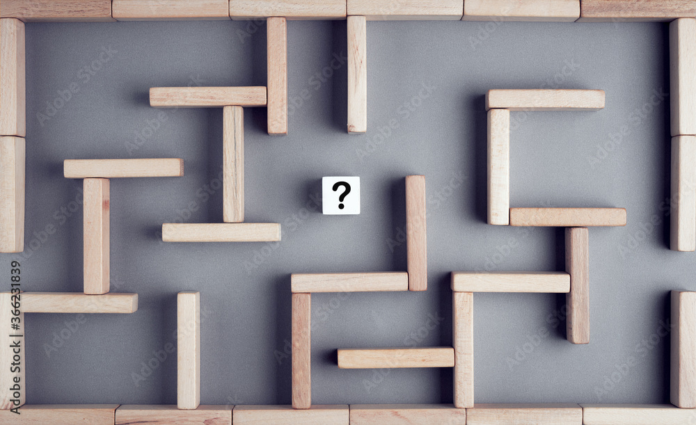 Poster maze or labyrinth made with wooden blocks with a wooden cube with question mark in the middle. busin