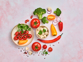 Tomato, spices, bell chili pepper, onion. Vegan diet food, creative composition on marble. Cherry tomatoes, bell pepper, broccoli, champignons layout, cooking colorful concept, top view.