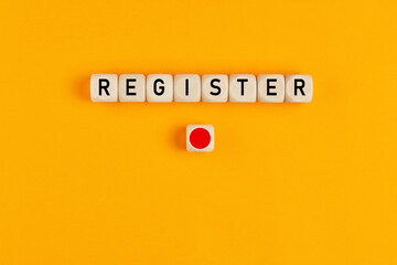 The word register written on wooden cubes with a push button on yellow background. Online...