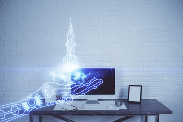 Desktop computer background in office and start up theme hologram drawing. Double exposure. Startup...